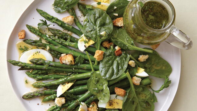 Asparagus salad with basil, pesto, hardboiled eggs, and croutons